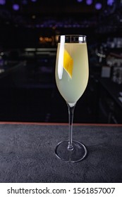 French 75 Alcoholic Cocktail Garnish With A Long Ribbon Of Lemon Peel