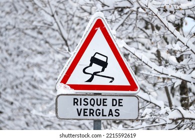 French Alps In Winter. Saint Gervais Mont-Blanc Village.  Road Traffic Sign Warning Of Slippery Roads. Saint-Gervais. France. 