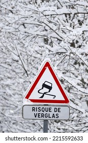 French Alps In Winter. Saint Gervais Mont-Blanc Village.  Road Traffic Sign Warning Of Slippery Roads. Saint-Gervais. France. 