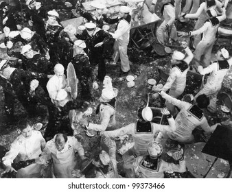 French And American Sailors Having Food Fight