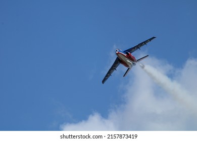 French army plane in the sky during an airshow