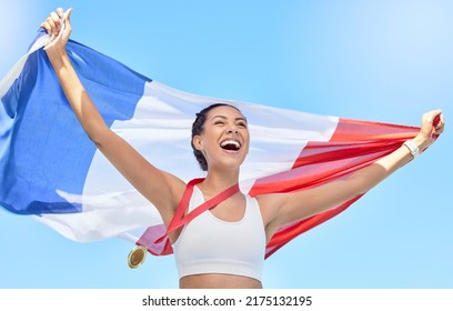 French athlete celebrating her gold medal olympic win, flying a flag. Smiling fit active sporty woman feeling motivated. Celebrating national pride and achieving gold medal in olympic sport - Powered by Shutterstock