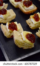 French Baguette Slices Topped With Brie Cheese And A Berry Compote.