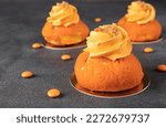 French cakes Chou of thin crispy choux pastry with a sweet shortcrust crust, mango and custard on gray background