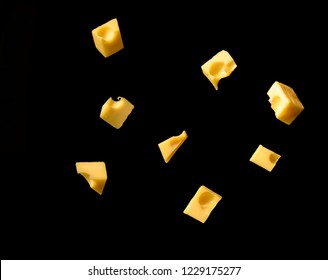 French cheese in pieces, floating in the air, suspended in the air, organic, natural, food