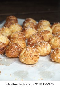 French Chouquettes coated with pearl sugar on baking tray