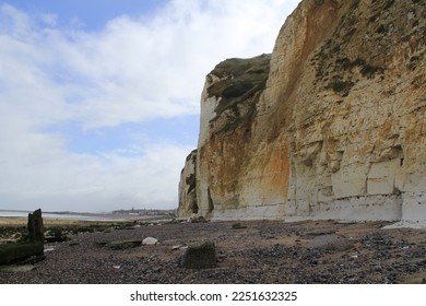 a french coast landscape with stones and pools at the beach along the big white cliffs in dieppe with low tide - Shutterstock ID 2251632325
