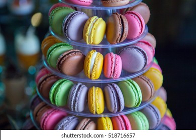 French colorful macaroons tower. Home made Traditional french dessert macaroons. Sweet delicacy. Candy bar.  Macaroons with cream in the middle.