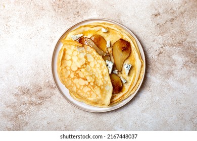 French Crepe with blue cheese and caramelized pears. Sweet and savoury homemade crepes pancakes recipe - Shutterstock ID 2167448037