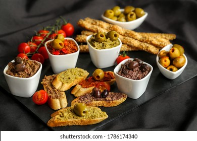 french cuisine, tapenade made with olives capers and provence herbs on a slate - Powered by Shutterstock