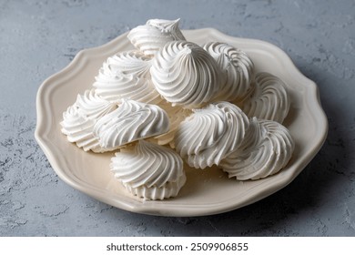 French dessert Meringue prepared from whipped with sugar and baked eggs. A cup of home-made meringues