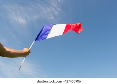 French flag against blue sky - Shutterstock ID 427453906