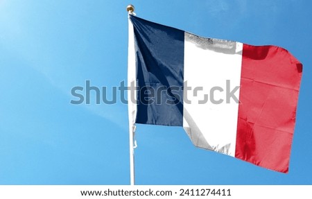 French flag in the cloudy sky. waving in the sky