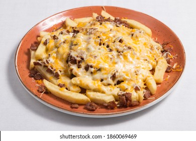 French Fries With Bacon And Cheese On A White Background