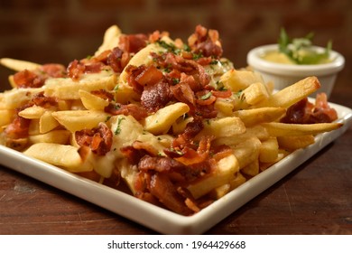 French Fries With Bacon On The Plate