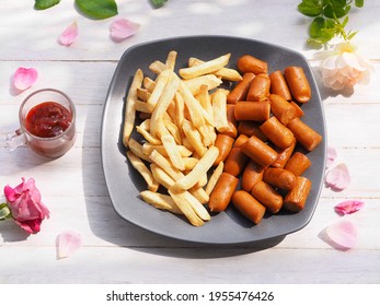 French Fries And Bacon Sausage Dry With Air Fryer Dip With Ketchup Sauce Serve On Wooden Desk