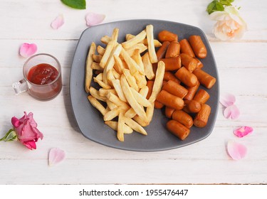 French Fries And Bacon Sausage Dry With Air Fryer Dip With Ketchup Sauce Serve On Wooden Desk