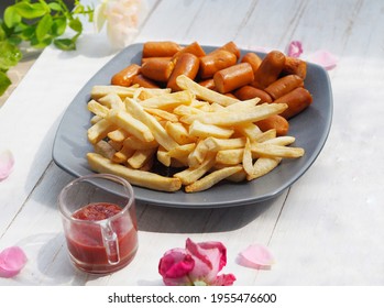 French Fries And Bacon Sausage Dry With Air Fryer Dip With Ketchup Sauce Serve On Wooden Desk