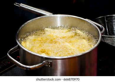 French Fries Boiling In Hot Oil - Shutterstock ID 666870970