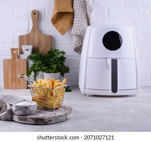 French fries cooked in air fryer. Healthy fat less food - Shutterstock ID 2071027121