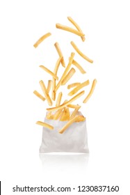 French fries flying out of paper packaging isolated on white background
