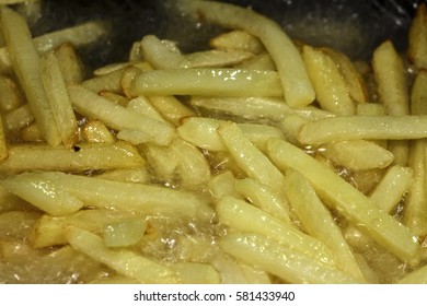 French Fries Frying In Oil In A Deep Fat Fryer