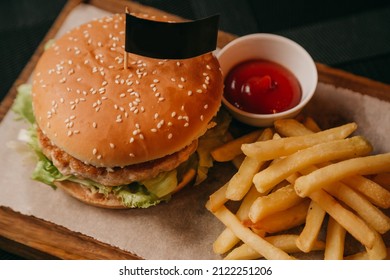 French Fries, Hamburger With Beef And Sauce, Concept Of Fast Food Place On The Flags For The Logo. Black Label Flag Mock Up For Your Logo