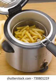 French Fries Into Deep Fryer