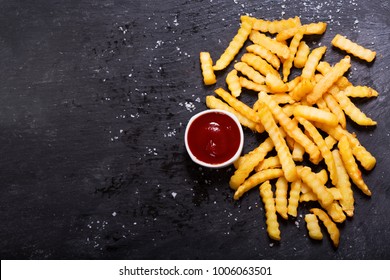 French Fries With Ketchup On Dark Table, Top View