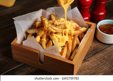 french fries with melted cheddar cheese on top