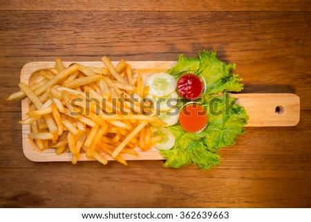 French fries on Hardwood Plate from Top view