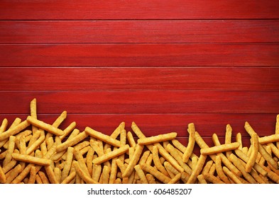 French Fries On Red Background.