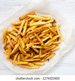 French Fries On White Wooden Surface, Top View, Close Up. Flat Lay, Overhead. 