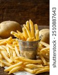 French fries on a wooden background