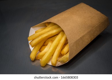 French Fries In Pack On A Table. Food Concept. Fast Food Potato Fries