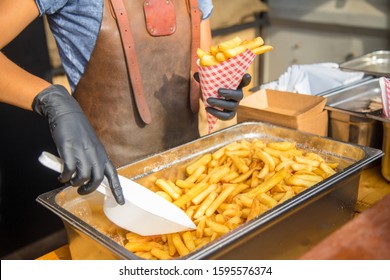 French Fries In Street Foodtruck With Vendor