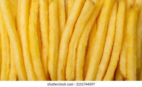 French Fries Texture Background. Fried Potato Sticks Pattern, Golden Fries Wallpaper, Roasted Potatoes, Finger Chips, Frites with Copy Space