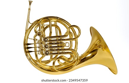 French horn: A coiled brass instrument played with valves and a wide bell, producing warm, rich tones. - Shutterstock ID 2349547359
