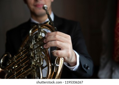 French Horn Instrument. Hands Playing Horn Player Close Up