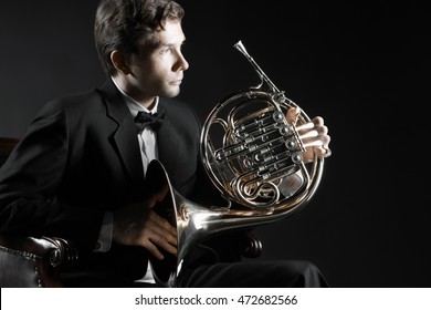 French Horn Player. Classical Musician Hornist With Horn Music Instrument 