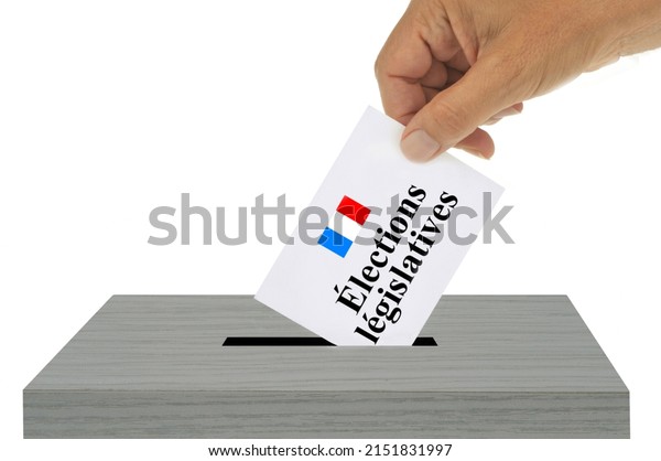French legislative election concept with a ballot\
slipped into the ballot box\
