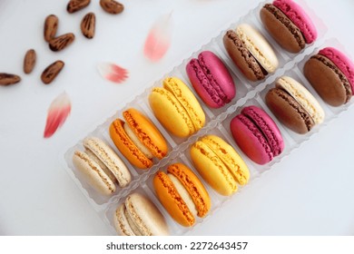French macaron sweets (also known as macaroons). Confectionery of France. Assorted macarons.