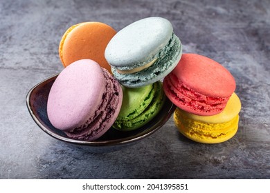 French macaroni. the most delicate cake is a cookie made of two smooth halves, fastened with stringy fillings.French pastry made from egg whites. French macaroni in different colors.