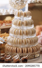 French macaroons. Candy bar. Wedding feast. Wedding sweets. beautiful macaron cake patisserie multi tier stand full of pastel macarons. pyramid tower.