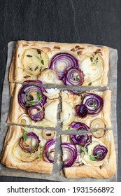 French  Onion Tart On Black Stone Background 