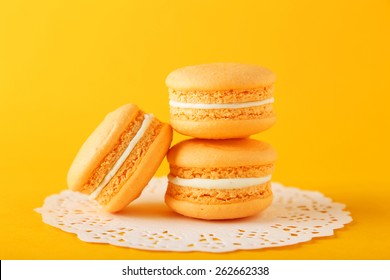 French Orange Macarons On Orange Background