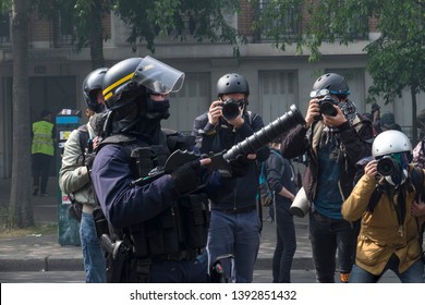 French Police Aims His Tear Gas Gun During The May Day Protest In Paris, France. 01/05/19
