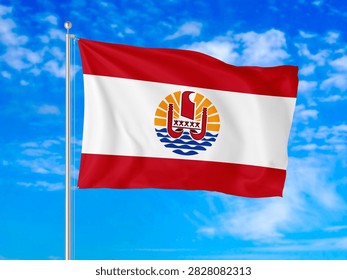 French Polynesia flag waving in the wind against a bright blue sky with white clouds.