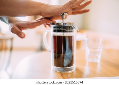 French press coffee. Friends waiting for coffee at the table in a Brazilian cafe shop. - Powered by Shutterstock