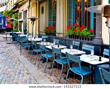 french restaurant - tables and chairs on the street - Paris, France